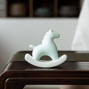 This Petite Ceramic Rocking Horse by Allthingscurated is a work of art. Crafted by hand from ceramic and decorated with a beautiful crackle pattern, it exudes a subtle far-eastern beauty and grace. Makes a perfect gift for those who appreciate quality craftsmanship and a treasured gift to any horse collector. Comes in green and azurerish white. Measures 9.8cm or 3.8 inches in height, 10.4cm or 4 inches in width and 4.2cm or 1.6 inches in depth. Featured here is an Azurerish White horse.