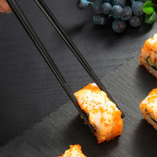 Load image into Gallery viewer, Bamboo Design Chinese Chopsticks by Allthingscurated are made from durable fiberglass polymer and heat-resistance. Stylish and sleek, the tapered end features an anti-slip design for easy and secure food picking. Enjoy 10 pairs of these high-quality chopsticks for all your Asian cuisine needs.
