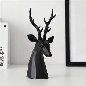 This beautiful Deer Head Bust sculpture is made of resin and comes available in 4 colors of black, white, gray and teal.  Measuring 26cm or 10 inches in height and 11.5cm or 4.5 inches in width. This figurine spots a contemporary design with sculptural form inspired by Origami. This decorative piece will add timeless elegance to your space year-round. Perfect for festive tablescapes, mantels and shelves.  This is a deer head bust in Black.