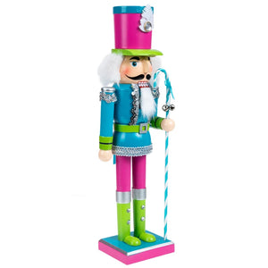 Neon Costume Nutcracker Soldiers by Allthingscurated.  These Nutcracker figures sport a psychedelic look with electric shades of Neon Blue, Green and Pink which is a daring and bold twist from the usual classic-style Nutcracker design. Their eye-catching colors and design will create a show-stopping look for your Christmas decor, making it truly unforgettable. Featured here is the Neon Blue Soldier.
