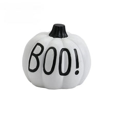 Load image into Gallery viewer, Halloween Pumpkin Tabletop Ornaments by Allthingscurated are the perfect additions to enhance the spooky ambience of your Halloween décor. Great for dressing up your dining table for a spooky gathering or simply pile them up on your mantels or tabletops as fun decorations for the season. Available in 4 different pumpkin designs. Featured here is white pumpkin design with boo wording.
