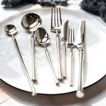 Load image into Gallery viewer, Bright Silver Stainless Steel flatware by Allthingscurated crafted from high-quality stainless steel with a forged construction ensures durability.  It has a bright silver mirror finish that will add a touch of elegance to any meal.
