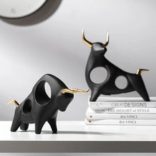 Load image into Gallery viewer, Brooklyn Bull Sculptures by Allthingscurated capture the elegance and dramatic aura of the auspicious animal in a sleek, modern design with matte black finish and gold-accented horns. A visually-appealing and timeless collection, it’s a fashionable piece to add to any contemporary home and spaces. And perfect as a gift for those with a Taurus horoscope or Chinese Ox zodiac sign.
