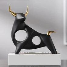 Load image into Gallery viewer, Brooklyn Bull Sculptures by Allthingscurated capture the elegance and dramatic aura of the auspicious animal in a sleek, modern design with matte black finish and gold-accented horns. A visually-appealing and timeless collection, it’s a fashionable piece to add to any contemporary home and spaces. And perfect as a gift for those with a Taurus horoscope or Chinese Ox zodiac sign. Featured here is the Fearless Bull Sculpture.
