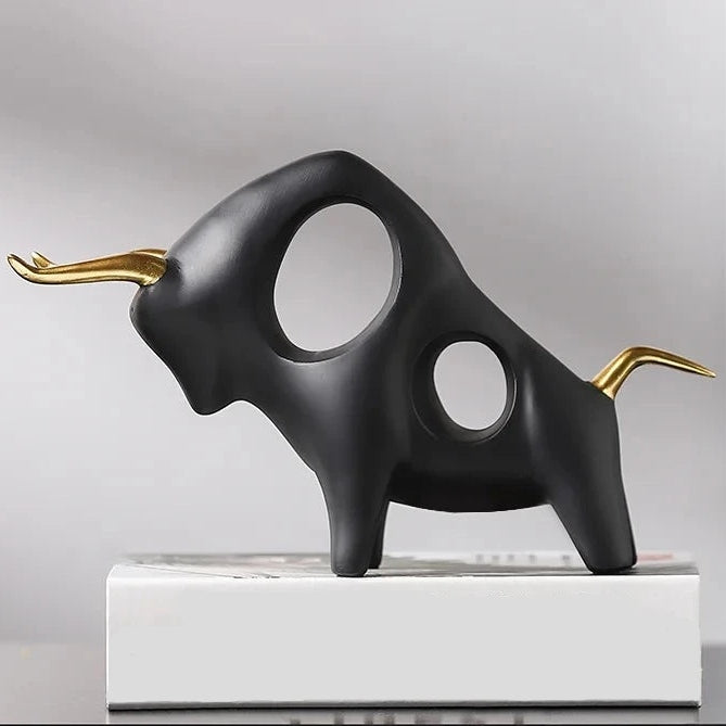 Brooklyn Bull Sculptures by Allthingscurated capture the elegance and dramatic aura of the auspicious animal in a sleek, modern design with matte black finish and gold-accented horns. A visually-appealing and timeless collection, it’s a fashionable piece to add to any contemporary home and spaces. And perfect as a gift for those with a Taurus horoscope or Chinese Ox zodiac sign. Featured here is the Charging Bull Sculpture.