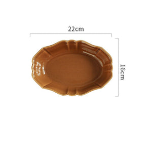French Style Ruffle Edge Dish by Allthingscurated are oval shallow serving dishes featuring a ruffle edge with curved rims. Come in 3 colors of white, green and brown and in 2 sizes.  This is a large brown dish measuring 22cm or 8.6 inches wide and 16cm or 6 inches in height.