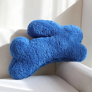 Cozy Teddy Bunny Pillow by Allthingscurated shaped like a cute bunny is sewn from soft, fluffy teddy fabric.  The hug pillow is cute, cuddly and oh-so-cozy. Its playful shape will bring a quirky charm to any room. Available in white, sand, red and blue. Featured here is blue bunny pillow.