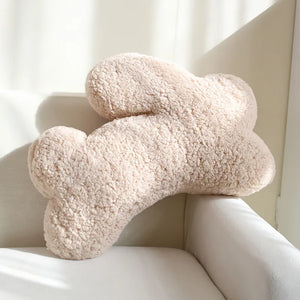 Cozy Teddy Bunny Pillow by Allthingscurated shaped like a cute bunny is sewn from soft, fluffy teddy fabric.  The hug pillow is cute, cuddly and oh-so-cozy. Its playful shape will bring a quirky charm to any room. Available in white, sand, red and blue. Featured here is sand bunny pillow.