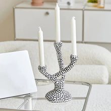 Load image into Gallery viewer, Whimsical Polka Dot Ceramic Candelabra by Allthingscurated combines abstract design with a touch of quirkiness, making it an aesthetically-pleasing piece for any modern and stylish homes. Perfect for lighting up your space with a touch of charm and personality; or as a decorative piece on its own.
