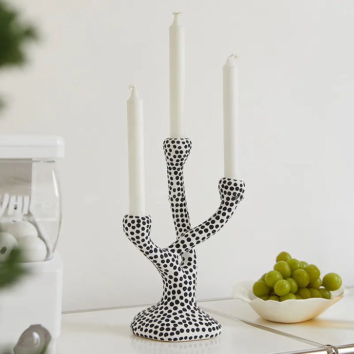 Whimsical Polka Dot Ceramic Candelabra by Allthingscurated combines abstract design with a touch of quirkiness, making it an aesthetically-pleasing piece for any modern and stylish homes. Perfect for lighting up your space with a touch of charm and personality; or as a decorative piece on its own.