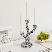 Load image into Gallery viewer, Whimsical Polka Dot Ceramic Candelabra by Allthingscurated combines abstract design with a touch of quirkiness, making it an aesthetically-pleasing piece for any modern and stylish homes. Perfect for lighting up your space with a touch of charm and personality; or as a decorative piece on its own.
