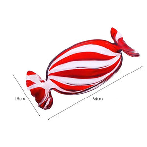 Peppermint Candy Glass Dish by Allthingscurated is a charming and beautiful dish inspired by the signature red and white peppermint candy cane synonymous with Christmas. Perfect as a serveware for your festive treats and also functional as a decorative tray for your coffee table. Measuring 34cm or 13 inches long, 15cm or 6 inches wide and 4cm or 1.6 inches high.