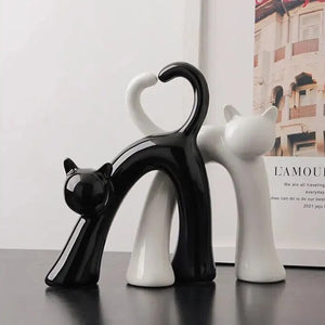 These Cat Couple Love Figurines by Allthingscurated are perfect for cat lovers. Made of ceramic, they feature a pair of cute and whimsical cats in contrasting colors, with their tails entwined to form a heart shape. A romantic and unique gift for any occasion.