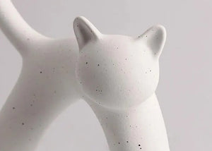 These Cat Couple Love Figurines by Allthingscurated are perfect for cat lovers. Made of ceramic, they feature a pair of cute and whimsical cats in contrasting colors, with their tails entwined to form a heart shape. A romantic and unique gift for any occasion.