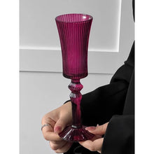 Load image into Gallery viewer, Cecily Flute Glasses by Allthingscurated feature a medieval-inspired vertical ridged design that provides a unique texture with an elegant touch. The long, sturdy stem ensures a steady hold while the jewel tones add a touch of sophistication to any celebration. Designed to complement your favorite wines, these glasses are perfect for entertaining and will brighten up any table.
