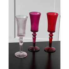 Load image into Gallery viewer, Cecily Flute Glasses by Allthingscurated feature a medieval-inspired vertical ridged design that provides a unique texture with an elegant touch. The long, sturdy stem ensures a steady hold while the jewel tones add a touch of sophistication to any celebration. Designed to complement your favorite wines, these glasses are perfect for entertaining and will brighten up any table.
