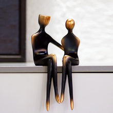 Load image into Gallery viewer, These pair of Abstract Couple Figurines has a modern and sleek design featuring a loving couple in embrace. It adds a touch of modern elegance to your space and looks sophisticated in their gradient black and bronze colors. Makes for a beautiful table tabletop decoration and perfect as a wedding or Valentine’s Day gift.

