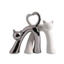 Load image into Gallery viewer, These Cat Couple Love Figurines by Allthingscurated are perfect for cat lovers. Made of ceramic, they feature a pair of cute and whimsical cats in contrasting colors, with their tails entwined to form a heart shape. A romantic and unique gift for any occasion.
