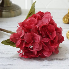 Load image into Gallery viewer, Silk Hydrangeas by Allthingscurated are made of premium quality silk that feature realistic looking flowers that are perfect for home décor and wedding venue decoration. Create a stunning display with 8 lovely colors available and add a touch of beauty and elegance to any space.  Featured here is the color Crimson Red.
