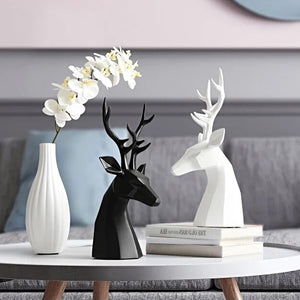This beautiful Deer Head Bust sculpture is made of resin and comes available in 4 colors of black, white, gray and teal.  Measuring 26cm or 10 inches in height and 11.5cm or 4.5 inches in width. This figurine spots a contemporary design with sculptural form inspired by Origami. This decorative piece will add timeless elegance to your space year-round. Perfect for festive tablescapes, mantels and shelves. 