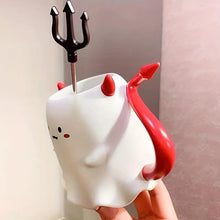 Load image into Gallery viewer, Cute Devil Mug by Allthingscurated features a devil design complete with red horns and tail, and even comes with a stirrer designed as a trident. Perfect for your personal cup or as a gift for friends and colleagues during Halloween season.
