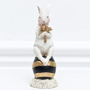 Our Regal Rabbit Family Figurines by Allthingscurated are beautifully-crafted and decorative. Made high-quality resin, these unique figurines will add a touch of elegance and whimsy to your home décor. Available in 6 designs, they are the perfect additions to your spring and Easter decorations. Featured here is Egg Sitting Rabbit.