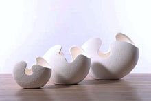 Load image into Gallery viewer, Egg Shell Decorative Pots by Allthingscurated spot an unconventional, egg shape design that looks aesthetically beautiful on its own as an ornamental piece, or full of character as a plant pot for your favorite botanicals. Made of ceramic and comes in 3 different sizes.
