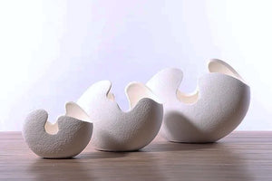 Egg Shell Decorative Pots by Allthingscurated spot an unconventional, egg shape design that looks aesthetically beautiful on its own as an ornamental piece, or full of character as a plant pot for your favorite botanicals. Made of ceramic and comes in 3 different sizes.