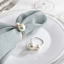 Load image into Gallery viewer, Faux Pearls Napkin Rings in a set of 6 by Allthingscurated are adorned with big and small pearls to create an overall look of elegance and sophistication.  They are perfect for special occasions. Come available in 4 different color combinations.
