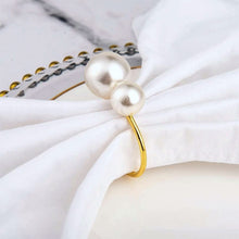 Load image into Gallery viewer, Faux Pearls Napkin Rings in a set of 6 by Allthingscurated are adorned with big and small pearls to create an overall look of elegance and sophistication.  They are perfect for special occasions. Come available in 4 different color combinations.
