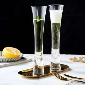 Combining style and functionality, Fion Champagne Flutes by Allthingscurated are hand-crafted from 100% lead-free crystal glass. These elegant flutes boast a sleek, modern, minimalistic design with a weighty base to provide stability and helps to maintain the temperature of your champagne. Comes in a set of 2 or 4 glasses. They are perfect for special occasion and make a stunning wedding gift.