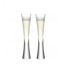 Load image into Gallery viewer, Combining style and functionality, Fion Champagne Flutes by Allthingscurated are hand-crafted from 100% lead-free crystal glass. These elegant flutes boast a sleek, modern, minimalistic design with a weighty base to provide stability and helps to maintain the temperature of your champagne. Comes in a set of 2 or 4 glasses. They are perfect for special occasion and make a stunning wedding gift. This is  2-piece set.
