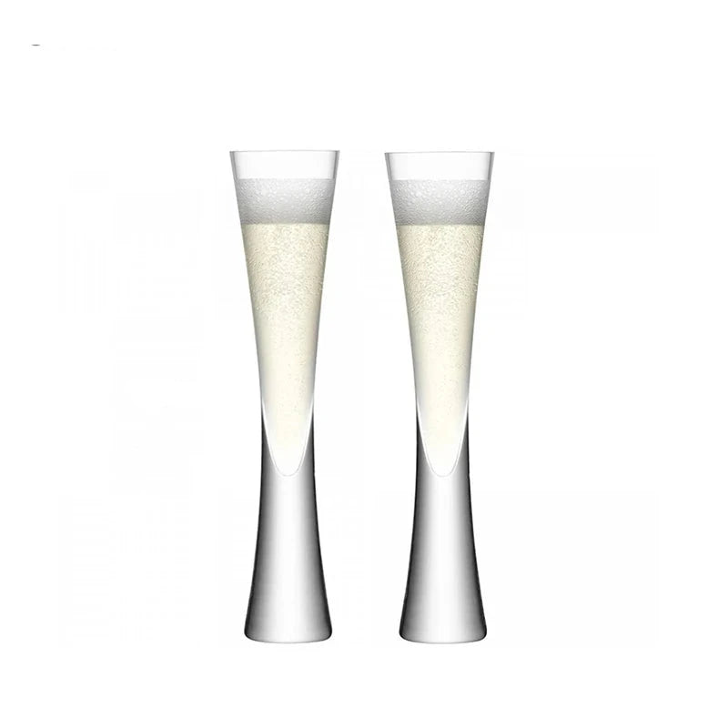 Combining style and functionality, Fion Champagne Flutes by Allthingscurated are hand-crafted from 100% lead-free crystal glass. These elegant flutes boast a sleek, modern, minimalistic design with a weighty base to provide stability and helps to maintain the temperature of your champagne. Comes in a set of 2 or 4 glasses. They are perfect for special occasion and make a stunning wedding gift. This is  2-piece set.