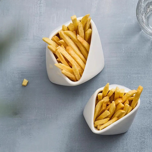 Porcelain French Fries Snack Bowl by Allthingscurated is inspired by the classic design of the French fries food packaging. Perfect for serving fries, the stylish and functional bowl makes your French fries look top-notch when dining at home with steak frites; and add a touch of flair to your casual meals. Come in 2 sizes.