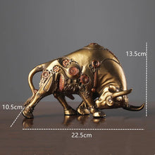 Load image into Gallery viewer, Futurox bull sculpture by Allthingscurated is the embodiment of steampunk aesthetics and futuristic mechanics. This exquisite masterpiece combines the grace and strength of a bull with the intricate beauty of gears. Standing at a height of 13.5cm or 5.3 inches, with length of 22.5cm or 8.8 inches and depth of 10.5cm or 4.1 inches. Its captivating presence will effortlessly elevate any space. Comes in gold and silver. Featured here the sculpture in Gold.
