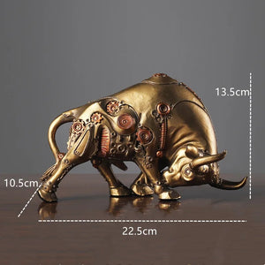 Futurox bull sculpture by Allthingscurated is the embodiment of steampunk aesthetics and futuristic mechanics. This exquisite masterpiece combines the grace and strength of a bull with the intricate beauty of gears. Standing at a height of 13.5cm or 5.3 inches, with length of 22.5cm or 8.8 inches and depth of 10.5cm or 4.1 inches. Its captivating presence will effortlessly elevate any space. Comes in gold and silver. Featured here the sculpture in Gold.