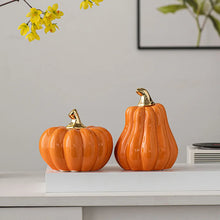 Load image into Gallery viewer, Glazed Ceramic Pumpkins by Allthingscurated spot a sculptural design that are perfect for adding a chic and stylish touch to your Halloween and Thanksgiving celebrations. Available in two designs in orange or white, let these ornamental pumpkins transform your home into a cozy autumn oasis.
