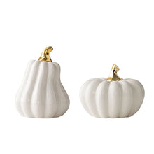 Load image into Gallery viewer, Glazed Ceramic Pumpkins by Allthingscurated spot a sculptural design that are perfect for adding a chic and stylish touch to your Halloween and Thanksgiving celebrations. Available in two designs in orange or white, let these ornamental pumpkins transform your home into a cozy autumn oasis. Featured here is the White Pumpkin Set consisting of a tall and short pumpkin.
