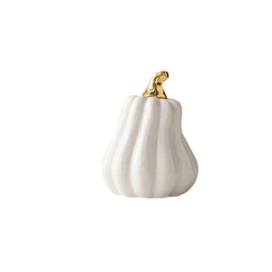 Glazed Ceramic Pumpkins by Allthingscurated spot a sculptural design that are perfect for adding a chic and stylish touch to your Halloween and Thanksgiving celebrations. Available in two designs in orange or white, let these ornamental pumpkins transform your home into a cozy autumn oasis. Featured here is the Tall Pumpkin in white.