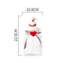 Load image into Gallery viewer, Christmas Festive Storage Jars by Allthingscurated are the perfect jars to keep all your festive treats fresh and delicious. The jars are airtight and each jar is topped with a ceramic lid decorated with a Santa Claus, Christmas Tree, Penguin, Gnome or Fox. Comes in 2 sizes with capacity of 300ml or 10 ounce and 1000ml or 34 ounce. Featured here is a large Gnome jar.
