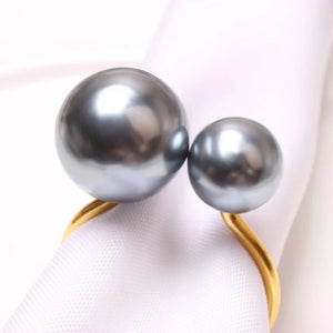 Faux Pearls Napkin Rings in a set of 6 by Allthingscurated are adorned with big and small pearls to create an overall look of elegance and sophistication.  They are perfect for special occasions. Come available in 4 different color combinations.