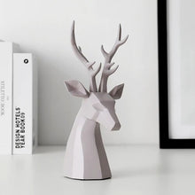 Load image into Gallery viewer, This beautiful Deer Head Bust sculpture is made of resin and comes available in 4 colors of black, white, gray and teal.  Measuring 26cm or 10 inches in height and 11.5cm or 4.5 inches in width. This figurine spots a contemporary design with sculptural form inspired by Origami. This decorative piece will add timeless elegance to your space year-round. Perfect for festive tablescapes, mantels and shelves.  This is a deer head bust in Gray.
