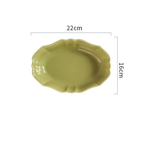 French Style Ruffle Edge Dish by Allthingscurated are oval shallow serving dishes featuring a ruffle edge with curved rims. Come in 3 colors of white, green and brown and in 2 sizes.  This is a large green dish measuring 22cm or 8.6 inches wide and 16cm or 6 inches in height.