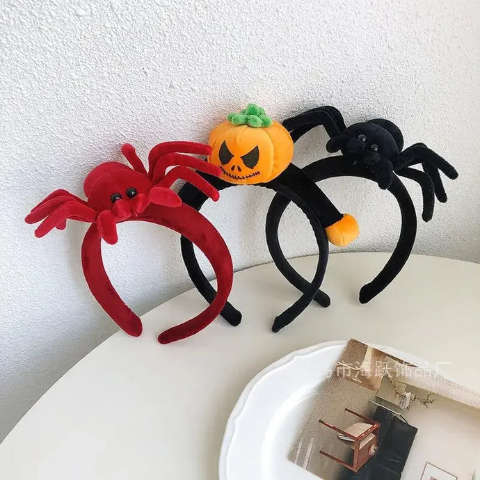 Featuring 3 cute designs, Plush Halloween Headbands by Allthingscurated blend comfort with style. They add a charming touch to your costume and create joyful photo moments to capture the festive spirit.
Halloween-themed headbands with red spider, black spider, and orange pumpkin design on a white surface.