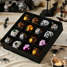 Load image into Gallery viewer, Halloween Decorative Bauble Set by Allthingscurated comes in a box containing 16 hand-painted ball ornaments featuring unique designs such as skulls, black cats, witches on broomsticks, white ghosts and creepy eyeballs. These decorated ornaments are perfect for adding an eclectic and quirky touch to your tree or home.
