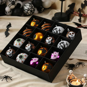 Halloween Decorative Bauble Set by Allthingscurated comes in a box containing 16 hand-painted ball ornaments featuring unique designs such as skulls, black cats, witches on broomsticks, white ghosts and creepy eyeballs. These decorated ornaments are perfect for adding an eclectic and quirky touch to your tree or home.