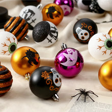 Load image into Gallery viewer, Halloween Decorative Bauble Set by Allthingscurated comes in a box containing 16 hand-painted ball ornaments featuring unique designs such as skulls, black cats, witches on broomsticks, white ghosts and creepy eyeballs. These decorated ornaments are perfect for adding an eclectic and quirky touch to your tree or home.
