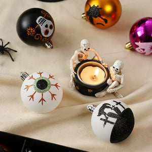 Halloween Decorative Bauble Set by Allthingscurated comes in a box containing 16 hand-painted ball ornaments featuring unique designs such as skulls, black cats, witches on broomsticks, white ghosts and creepy eyeballs. These decorated ornaments are perfect for adding an eclectic and quirky touch to your tree or home.