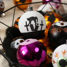 Load image into Gallery viewer, Halloween Decorative Bauble Set by Allthingscurated comes in a box containing 16 hand-painted ball ornaments featuring unique designs such as skulls, black cats, witches on broomsticks, white ghosts and creepy eyeballs. These decorated ornaments are perfect for adding an eclectic and quirky touch to your tree or home.
