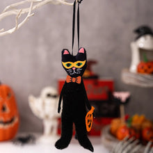 Load image into Gallery viewer, Black cat Halloween ornament with a bow tie on a decorative background. These adorable Halloween Decorative Hangings Dolls by Allthingscurated spark joy and give your Holiday decor a fun and eerie vibe.

